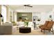 Open-concept living room with modern furnishings, stylish decor, and natural light at 9452 Runaway Breeze Dr, Land O Lakes, FL 34637