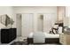 Modern bedroom with dual closets, sleek furnishings, and contemporary design at 9455 Runaway Breeze Dr, Land O Lakes, FL 34637
