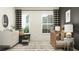 Light-filled Bedroom with a white dresser, wooden crib, and striped curtains at 9455 Runaway Breeze Dr, Land O Lakes, FL 34637