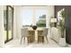 Bright dining room featuring a wooden table with four chairs, under large windows at 9455 Runaway Breeze Dr, Land O Lakes, FL 34637