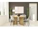 Inviting dining area showcases stylish table and chairs with decorative plants at 9455 Runaway Breeze Dr, Land O Lakes, FL 34637