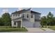 Charming two-story home with a modern architectural design and well-maintained landscaping at 9455 Runaway Breeze Dr, Land O Lakes, FL 34637