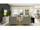 Stylish living room featuring comfortable seating, modern decor, and plenty of natural light at 9455 Runaway Breeze Dr, Land O Lakes, FL 34637