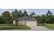 Charming single-story home with a two-car garage, well-maintained lawn, and mature landscaping at 9468 Runaway Breeze Dr, Land O Lakes, FL 34637