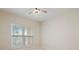 This bedroom has neutral colors and a window with blinds at 1216 S Missouri Ave # 224, Clearwater, FL 33756