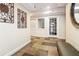 The hallway features decorative wall art, tiled floors, and a door that leads to another room at 1216 S Missouri Ave # 224, Clearwater, FL 33756