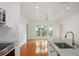 Open-concept living area with wood floors, recessed lighting and granite counters at 1216 S Missouri Ave # 224, Clearwater, FL 33756