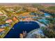 Aerial view of a community center with a lake, pool, and sports fields at 10534 Bermuda Isle Dr, Tampa, FL 33647