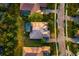Aerial view of a private home with a screened in pool and well-manicured landscaping at 10534 Bermuda Isle Dr, Tampa, FL 33647