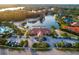 Aerial view of a community center featuring a lake, community pool, and ample parking at 10534 Bermuda Isle Dr, Tampa, FL 33647