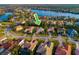 Aerial view of a single-Gathering home in a waterfront community with well-manicured lawns and mature trees at 10534 Bermuda Isle Dr, Tampa, FL 33647