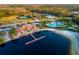 Aerial view of a community center featuring a large pool with palm trees and beach at 10534 Bermuda Isle Dr, Tampa, FL 33647