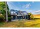Screened in pool area with a lush tropical backdrop at 10534 Bermuda Isle Dr, Tampa, FL 33647