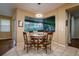 Cozy dining area featuring a round table, four chairs, and large window view at 10534 Bermuda Isle Dr, Tampa, FL 33647
