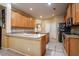 Well-lit kitchen featuring wood cabinets, tile floors, and ample counter space at 10534 Bermuda Isle Dr, Tampa, FL 33647