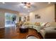 Spacious living room with hardwood floors and a large sliding glass door to patio at 10534 Bermuda Isle Dr, Tampa, FL 33647