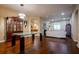 Open-concept room with hardwood flooring, dining area, and comfortable seating at 10534 Bermuda Isle Dr, Tampa, FL 33647