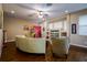 Inviting living room with hardwood floors, ceiling fan, and comfortable seating at 10534 Bermuda Isle Dr, Tampa, FL 33647