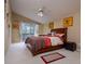 Main bedroom features a vaulted ceiling, ceiling fan, and sliding glass doors to the lanai at 10534 Bermuda Isle Dr, Tampa, FL 33647