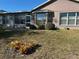 Lush backyard with large windows providing scenic views and natural light at 11138 Brooklawn Dr, Hudson, FL 34667