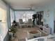 Relaxing sunroom with neutral decor, a ceiling fan, and plenty of natural light at 11138 Brooklawn Dr, Hudson, FL 34667