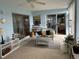 Inviting sunroom with comfortable seating, sliding glass doors, and serene views at 11138 Brooklawn Dr, Hudson, FL 34667