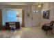 Bright living room with tile flooring, a desk and a large window at 11138 Brooklawn Dr, Hudson, FL 34667