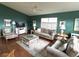 Comfortable living room with hardwood floors, vaulted ceilings, and a ceiling fan at 11138 Brooklawn Dr, Hudson, FL 34667
