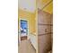 Bathroom with a tiled shower, and a vanity, with view to the bright and airy office at 11209 Bloomington Dr, Tampa, FL 33635
