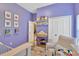 Charming bedroom featuring colorful decor, closet, and reading nook, perfect for children at 11209 Bloomington Dr, Tampa, FL 33635