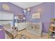 Charming Bedroom with a crib, dresser, and decor at 11209 Bloomington Dr, Tampa, FL 33635