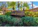 Elegant community entrance sign reading 'The Estates' surrounded by manicured landscaping, offering a grand welcome at 11209 Bloomington Dr, Tampa, FL 33635