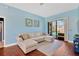 Cozy living room with comfortable seating and sliding glass doors leading to the pool area at 11209 Bloomington Dr, Tampa, FL 33635