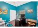 Well-lit home office with desk, chair, and closet space at 11209 Bloomington Dr, Tampa, FL 33635