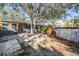 A backyard featuring a pool, deck, and mature trees at 1157 Brook Rd, Clearwater, FL 33755