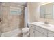 Well-lit bathroom features a shower and a modern vanity at 1157 Brook Rd, Clearwater, FL 33755