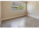 A cozy bedroom featuring natural light from the window at 1157 Brook Rd, Clearwater, FL 33755