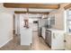 Bright kitchen featuring a central island, stainless steel appliances, and ample cabinet space at 1157 Brook Rd, Clearwater, FL 33755