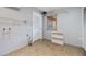Laundry room with tile flooring and storage shelves at 1157 Brook Rd, Clearwater, FL 33755