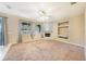 Cozy living room with a fireplace, built-in shelving, neutral colors, and great natural light at 12816 Pacifica Pl, Tampa, FL 33625