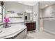 Beautiful bathroom featuring a soaking tub, granite vanity, walk-in shower, and decorative shelving at 13711 Moonstone Canyon Dr, Riverview, FL 33579