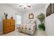 Cozy bedroom with a queen-size bed, floral accents, and natural light at 13711 Moonstone Canyon Dr, Riverview, FL 33579