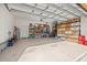 Spacious two car garage with lots of storage racks and room for work space at 13711 Moonstone Canyon Dr, Riverview, FL 33579
