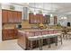 Open kitchen with stainless steel appliances, granite countertops, kitchen island, and tile backsplash at 13711 Moonstone Canyon Dr, Riverview, FL 33579