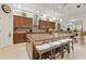 Bright kitchen featuring stainless steel appliances, a large island with seating, and recessed lighting at 13711 Moonstone Canyon Dr, Riverview, FL 33579