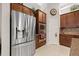 Kitchen featuring stainless steel appliances, dark wood cabinets, and granite countertops at 13711 Moonstone Canyon Dr, Riverview, FL 33579