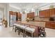 Gourmet kitchen with stainless steel appliances, granite countertops, and a large island with seating at 13711 Moonstone Canyon Dr, Riverview, FL 33579