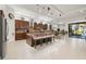 Open concept kitchen and dining area with stainless steel appliances, tile floors, and recessed lighting at 13711 Moonstone Canyon Dr, Riverview, FL 33579