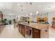 An open kitchen showcasing a spacious island with seating and modern stainless steel appliances at 13711 Moonstone Canyon Dr, Riverview, FL 33579