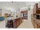 Kitchen featuring large island, seating, stainless steel appliances, and open floor plan at 13711 Moonstone Canyon Dr, Riverview, FL 33579